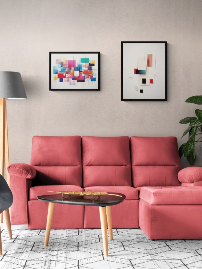 wall art set above a red couch in living room