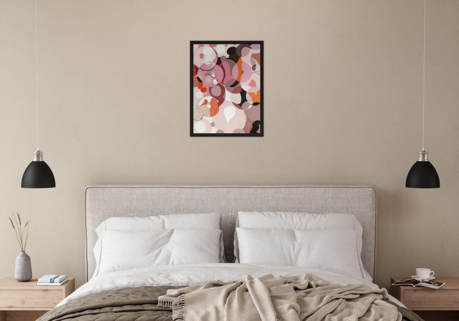 pink and rose abstract wall art with circles art in a couples bedroom above bed
